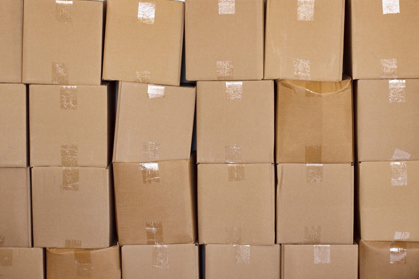 A pile of cardboard boxes stacked on top of each other.