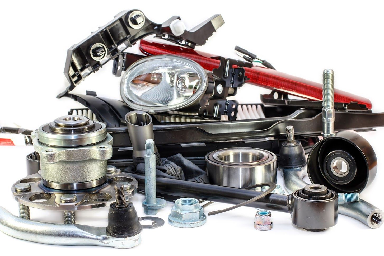 A pile of car parts on a white background.