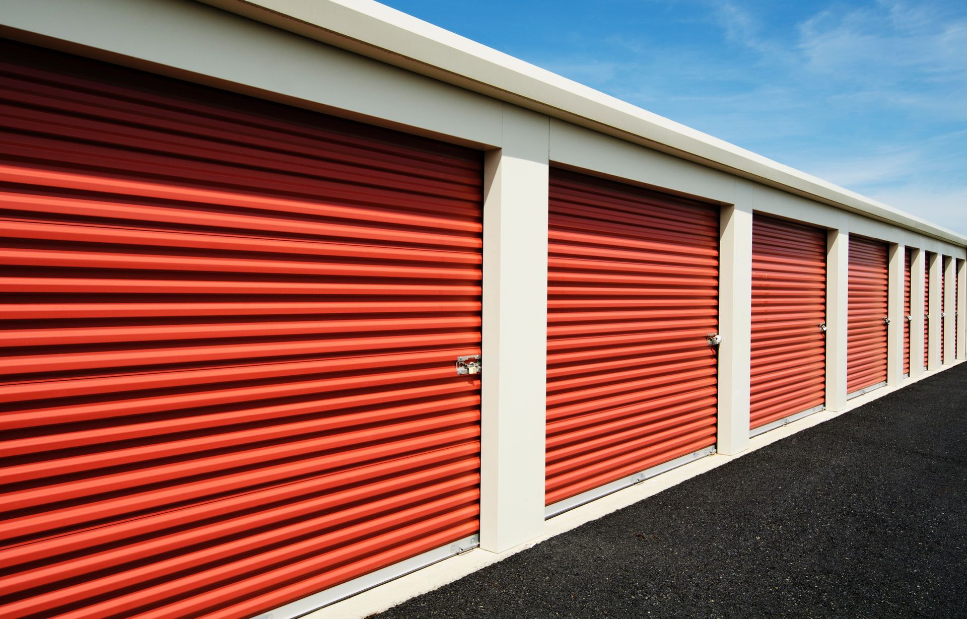 Self-Storage warehouse building with multiple units, offering secure & accessible storage solutions.