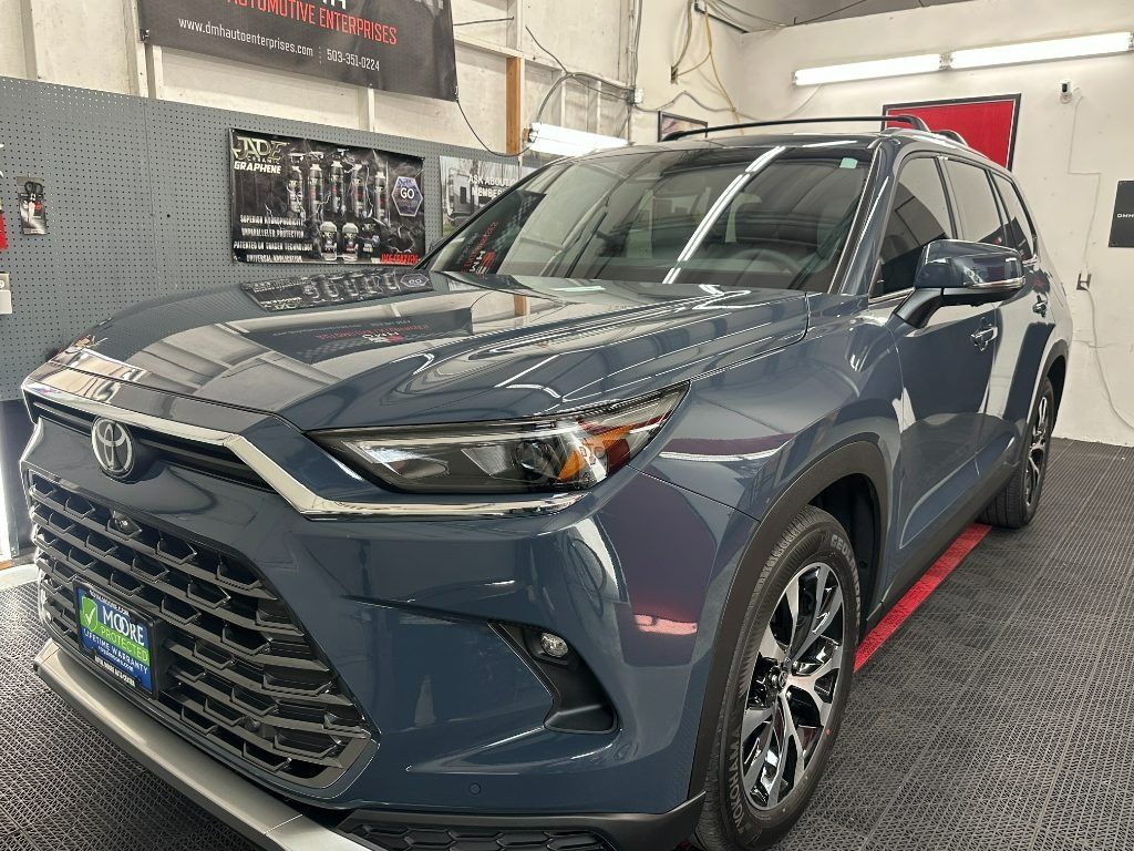 Blue Toyota SUV in a showroom, front three-quarter view on a display floor