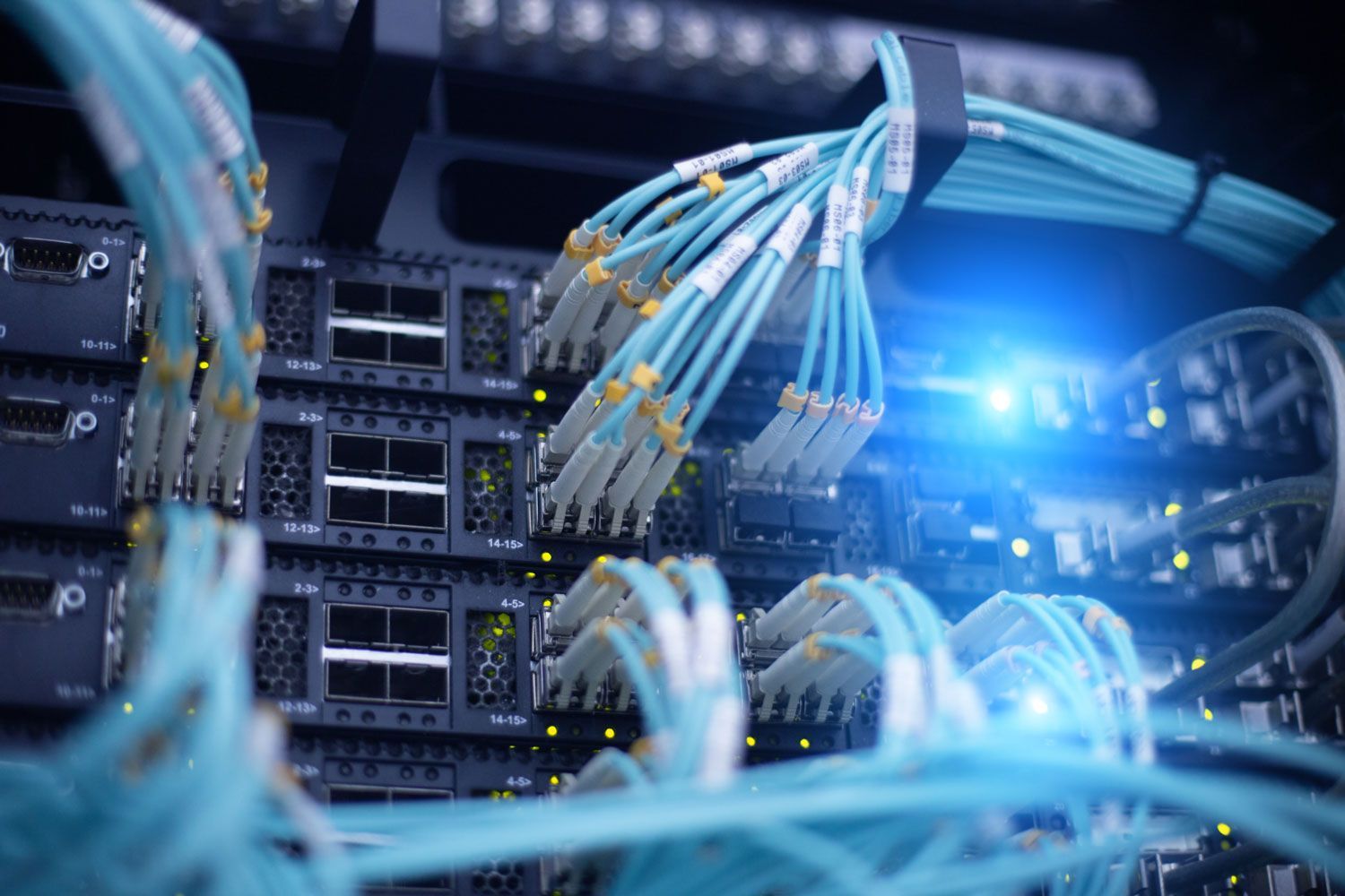 Telecommunication optical rack with fibre cables in a data centre.