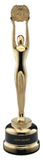 Gold trophy figure with raised arms on a black base, featuring a round medallion at the top.