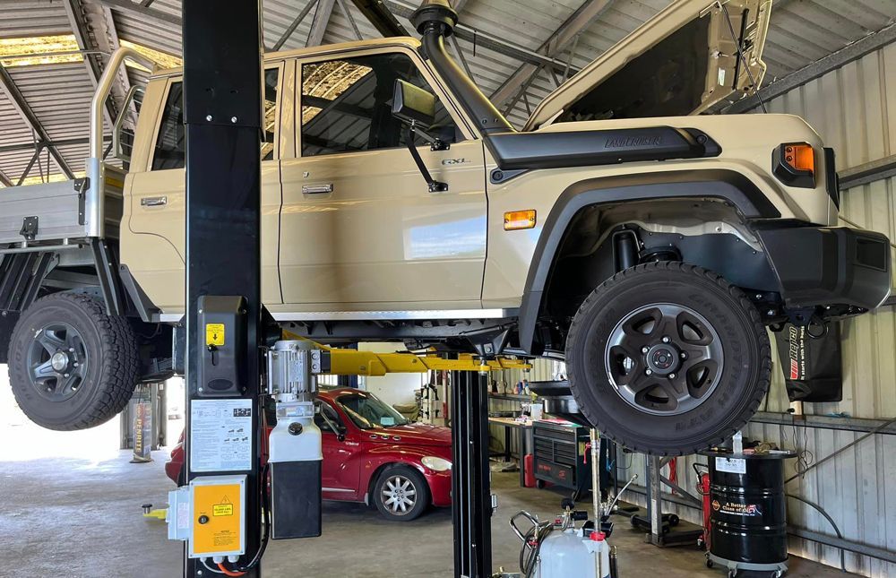 Car Tire and Suspension Under a Vehicle, Showing the Wheel, and Control Arm — KBX Mechanical In West Mackay, QLD