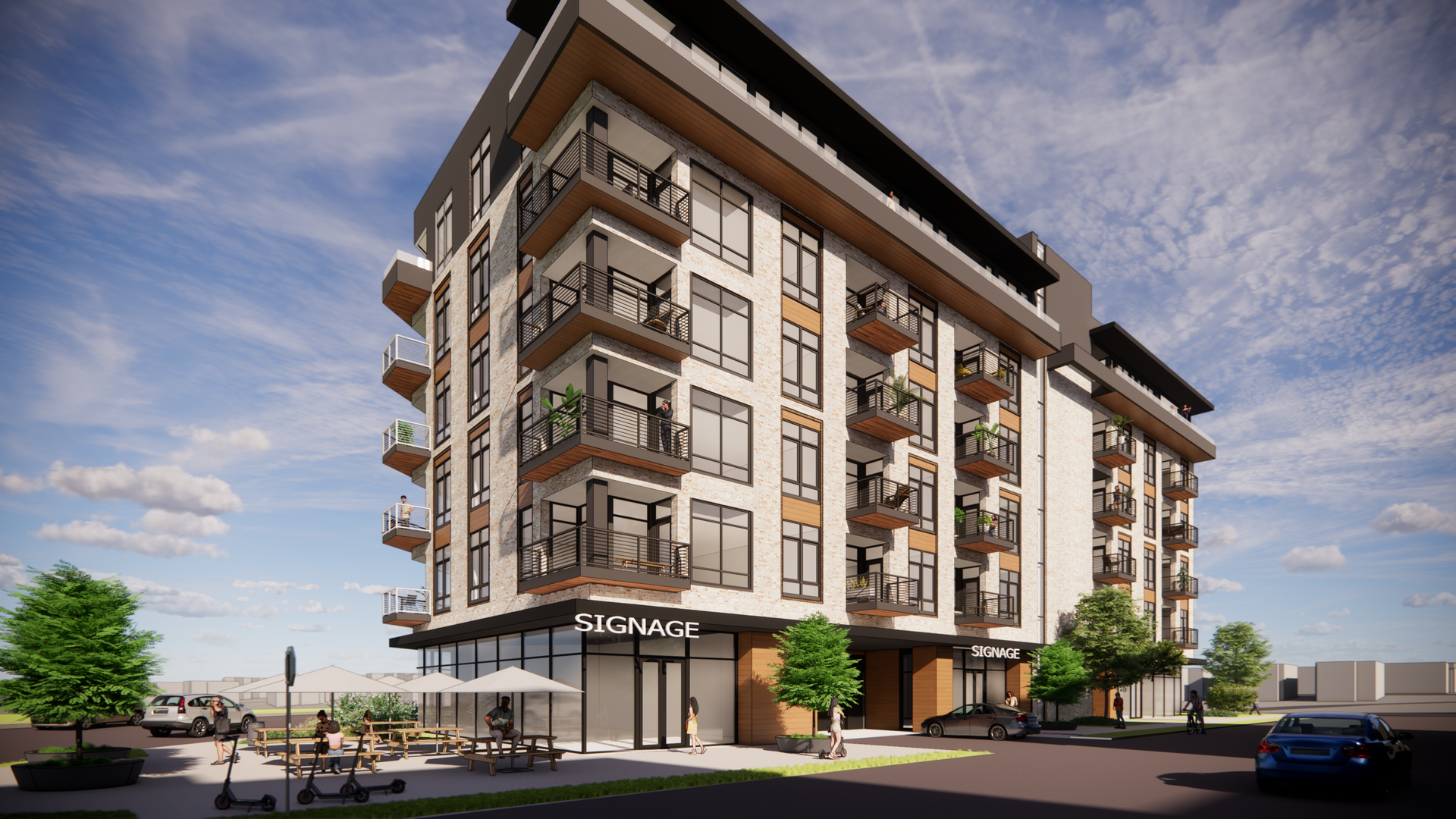 Modern apartment building with balconies and ground-floor storefront, sunny day.
