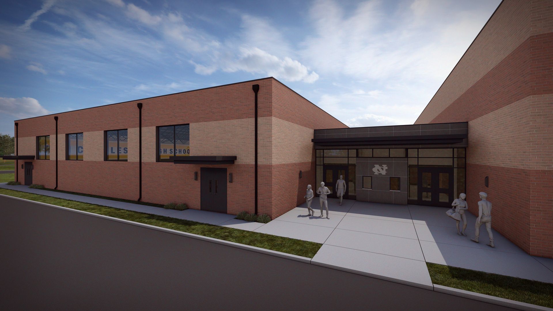 Brick building entrance with people; sunny day.