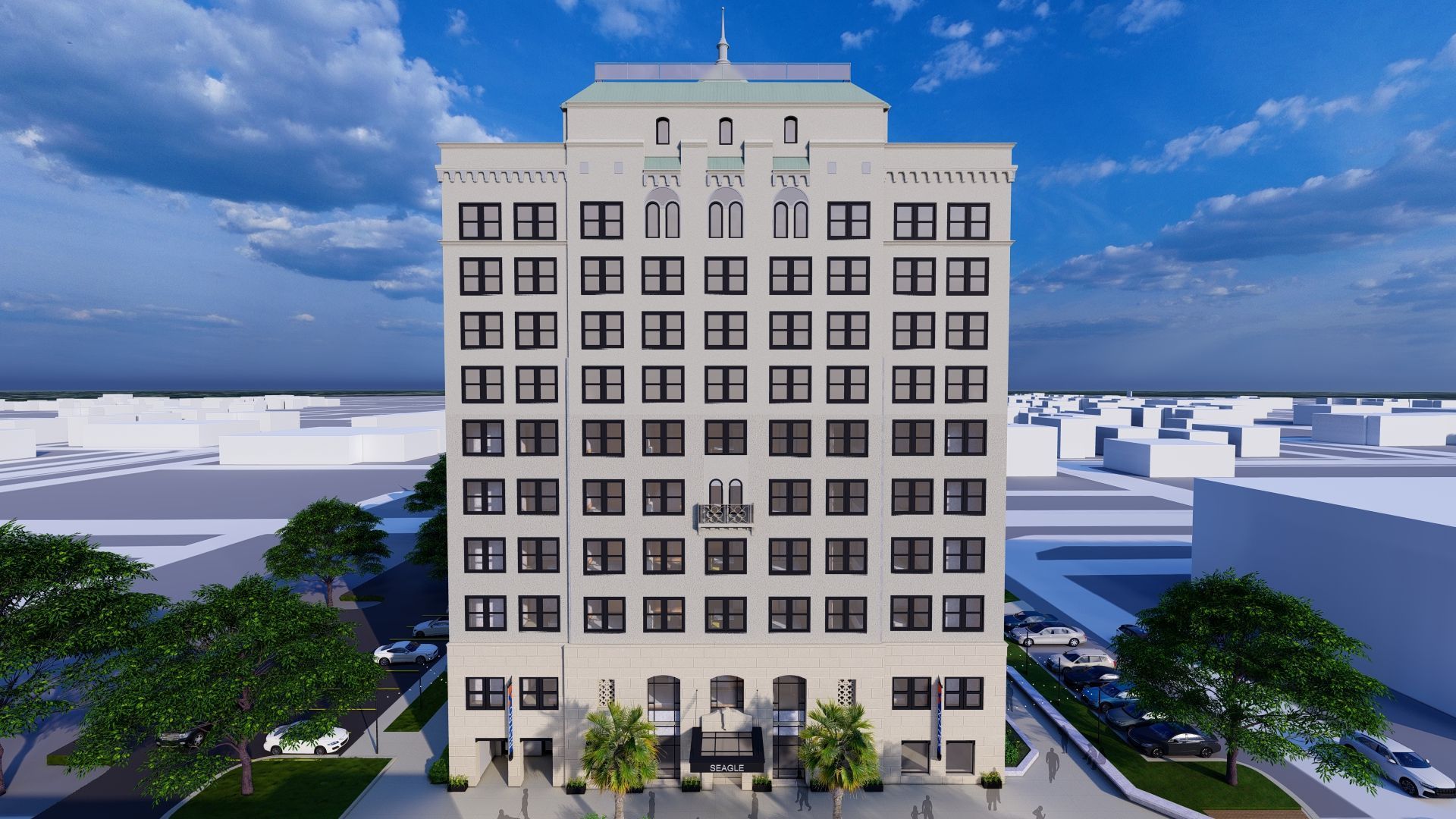 Tall light-colored building with many windows, topped with a decorative roof, viewed from street level.