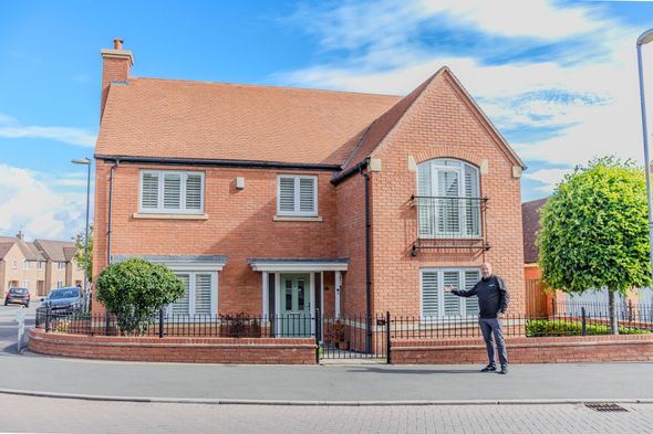Daniel Ansell outside a residential property during his estate agency career