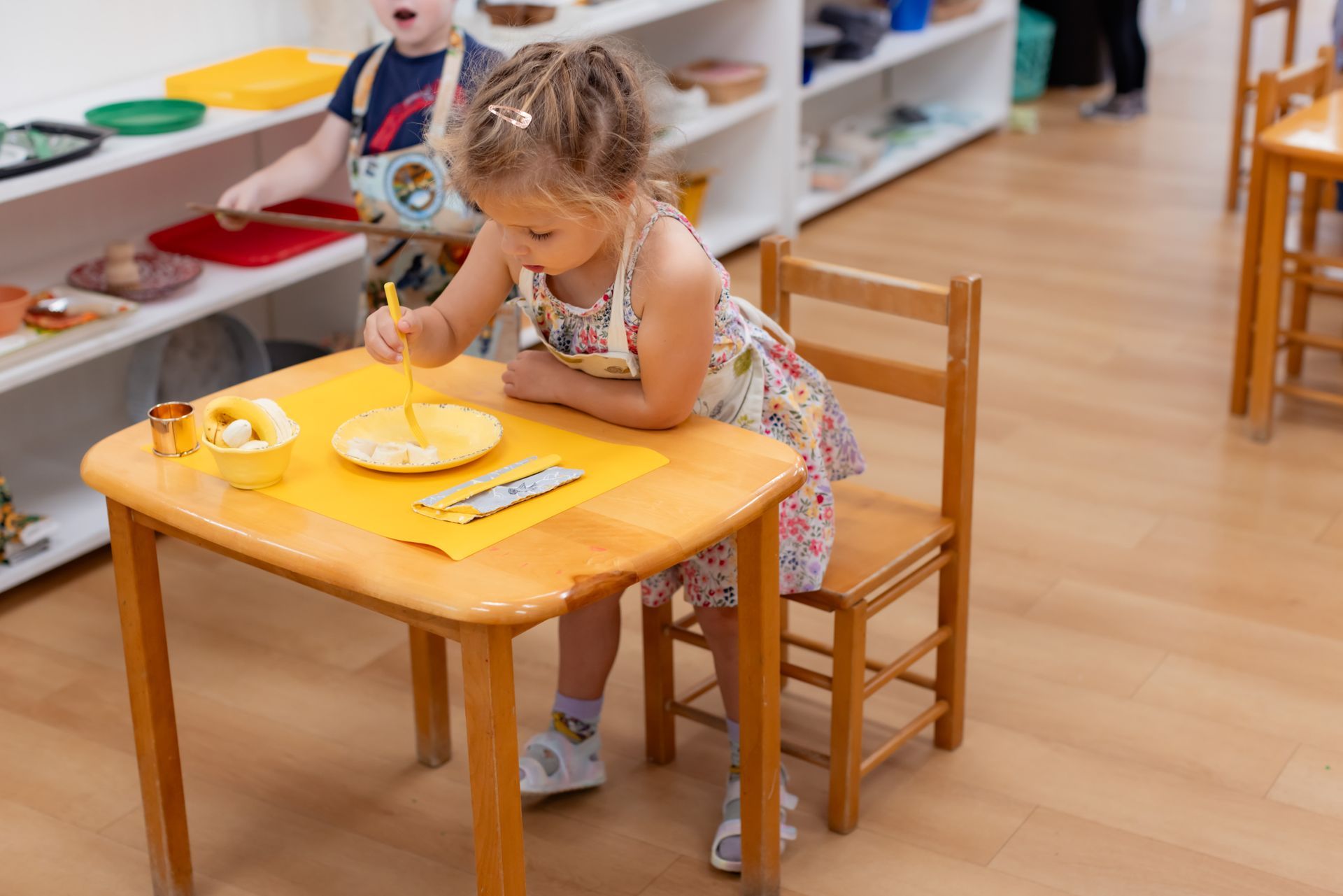 Montessori child eating a snack