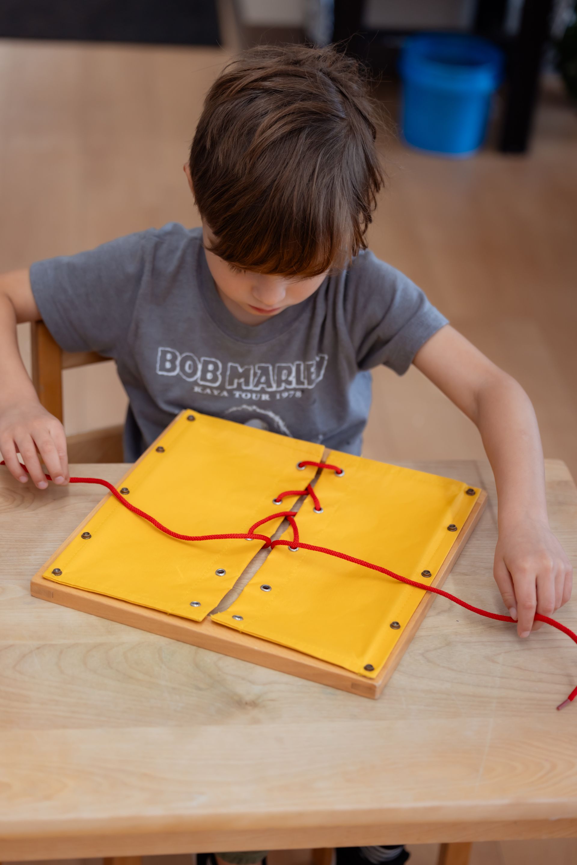 Montessori child working on practical life skills