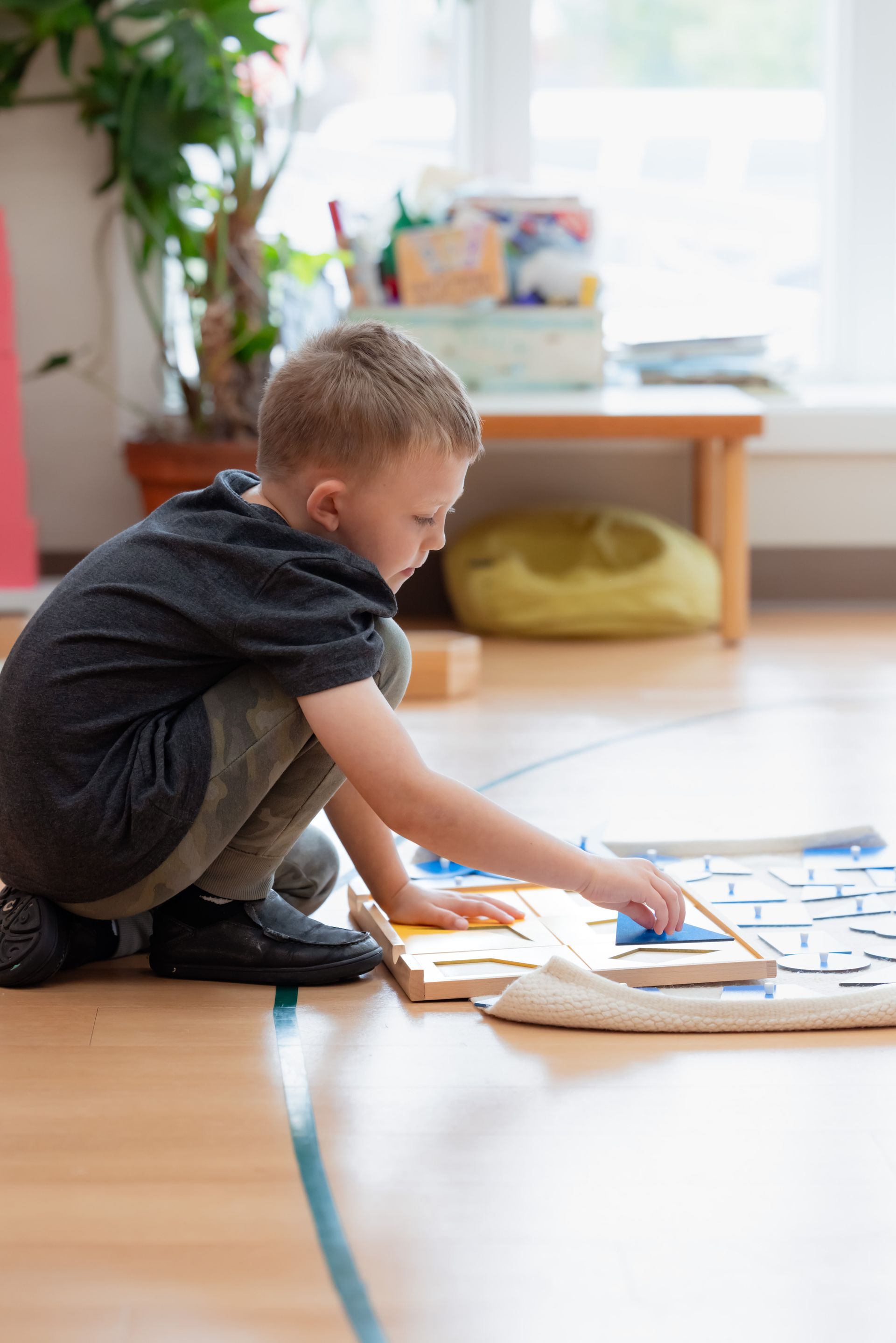 Montessori child working with a puzzle