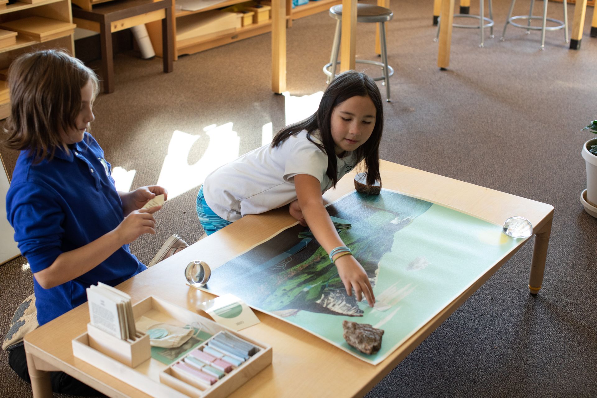 Montessori child working with cultural materials