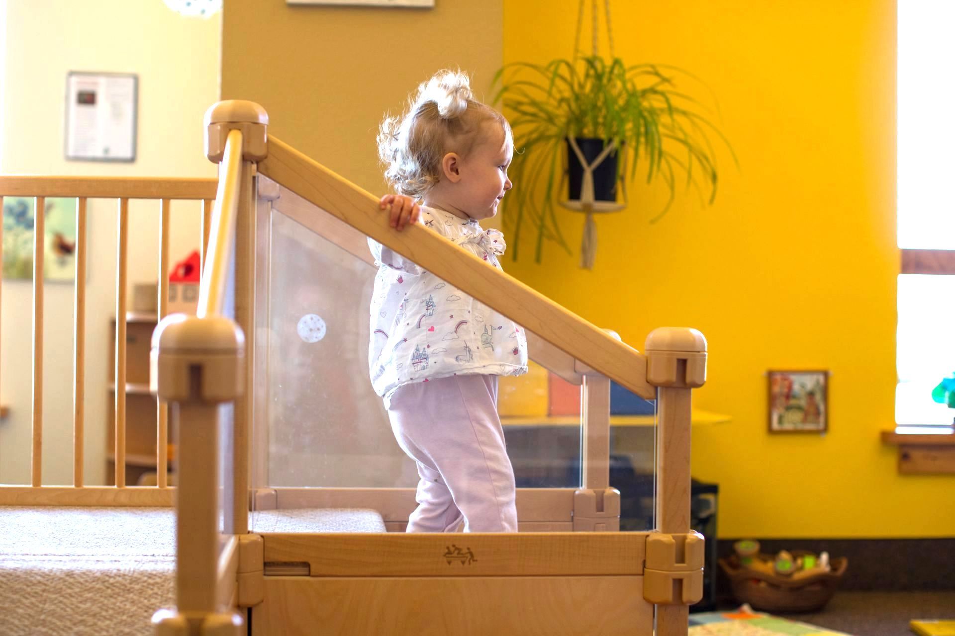 Montessori toddler walking on stairs