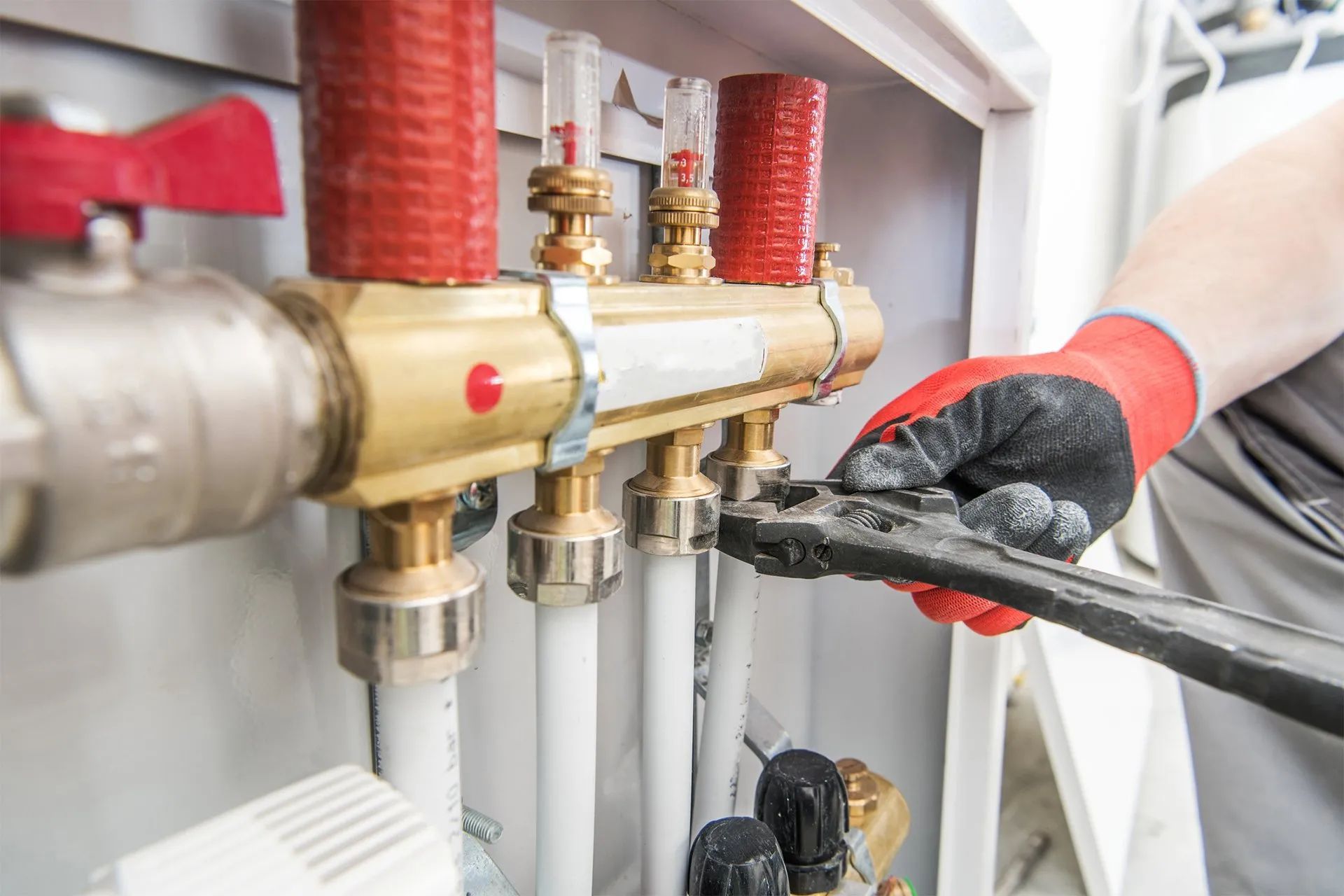 Plumber repairing water heater