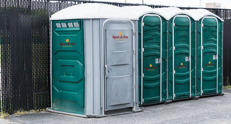 Porta Toilets Set up In a Parking Lot — White Marsh, MD — Spot A Pot Porta Toilets Set up In a Parking Lot — White Marsh, MD — Spot A Pot