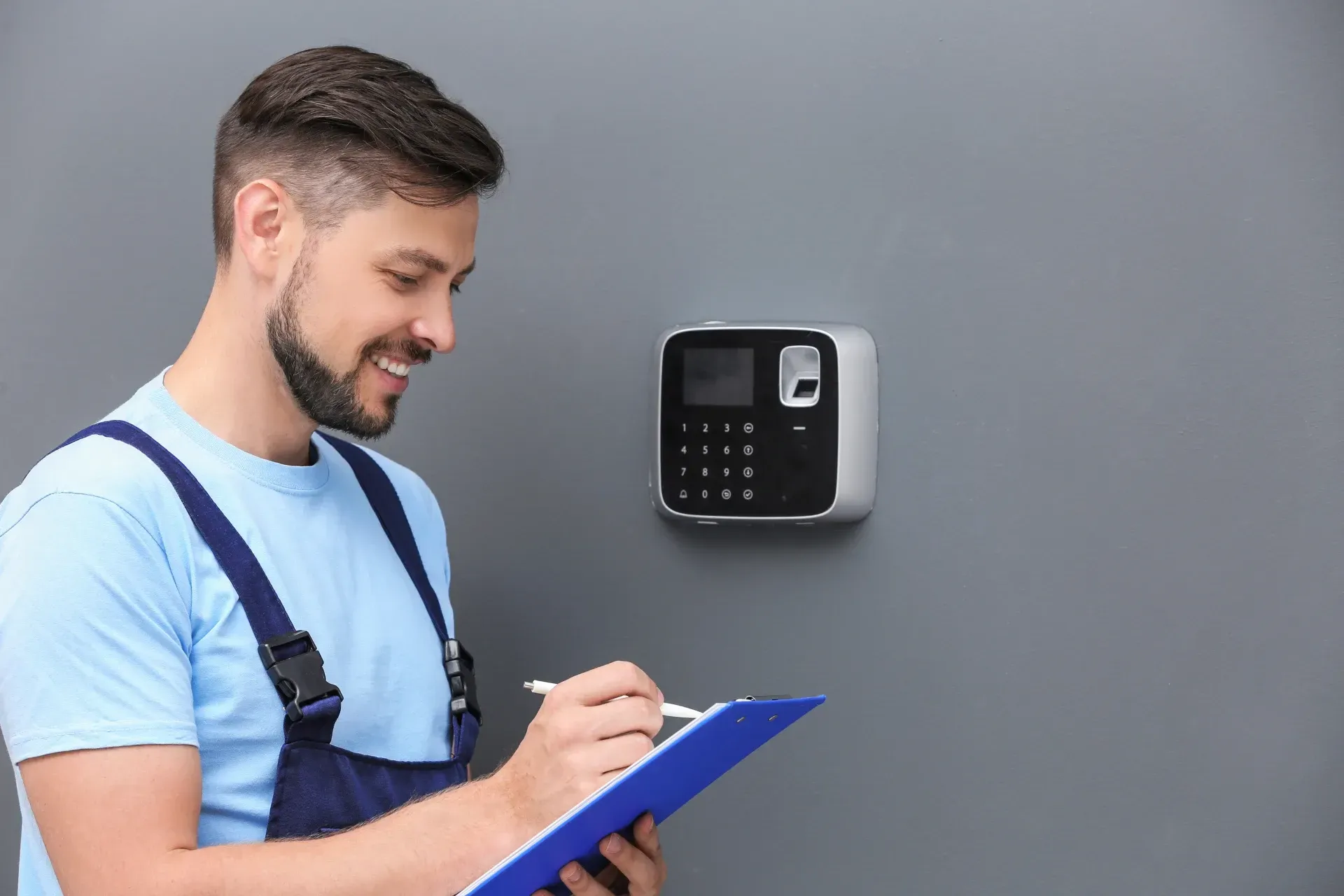 Security professional doing maintenance on the security system