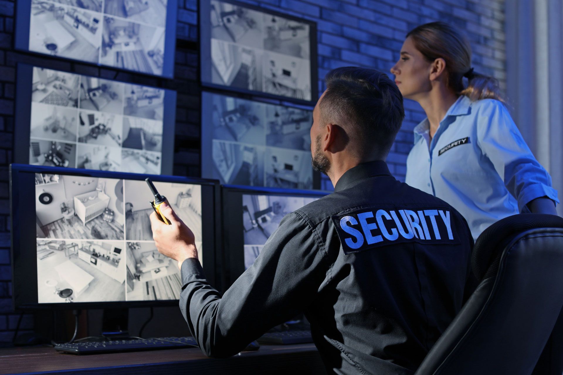 Security experts monitoring surveillance cameras
