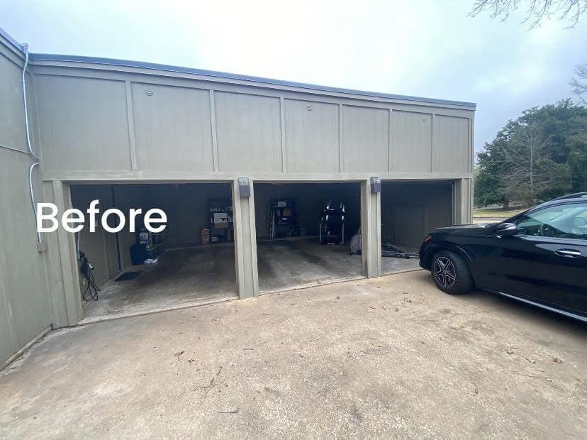 A tan three-car carport with open bays and a black SUV parked to the right, labeled with the word 