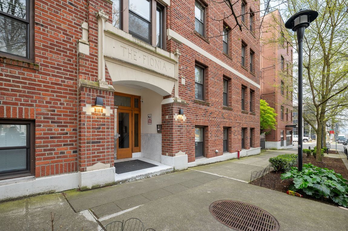 Photo of the front of the apartment building, seen from the ground floor, outside the entrance to the lobby