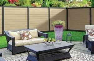 A patio with a couch , chairs , and a coffee table.