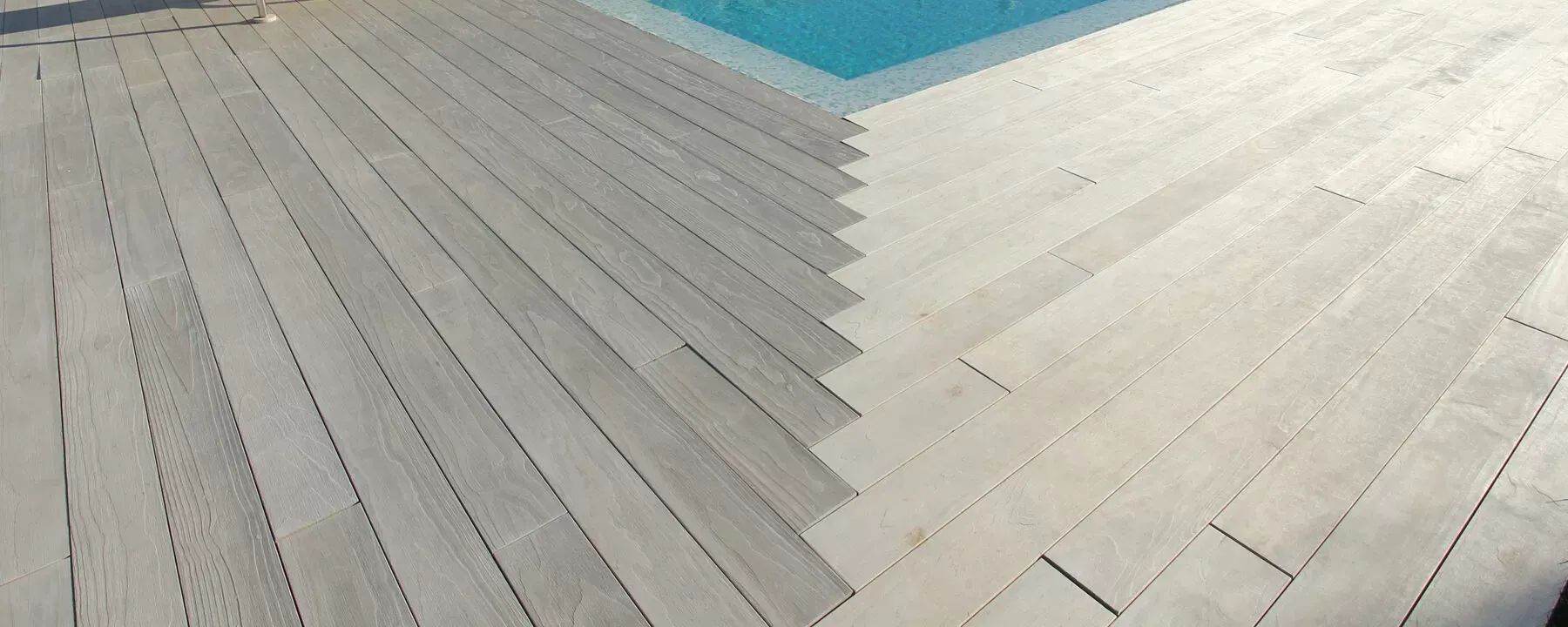 a staircase leading up to a swimming pool with a white tile floor .