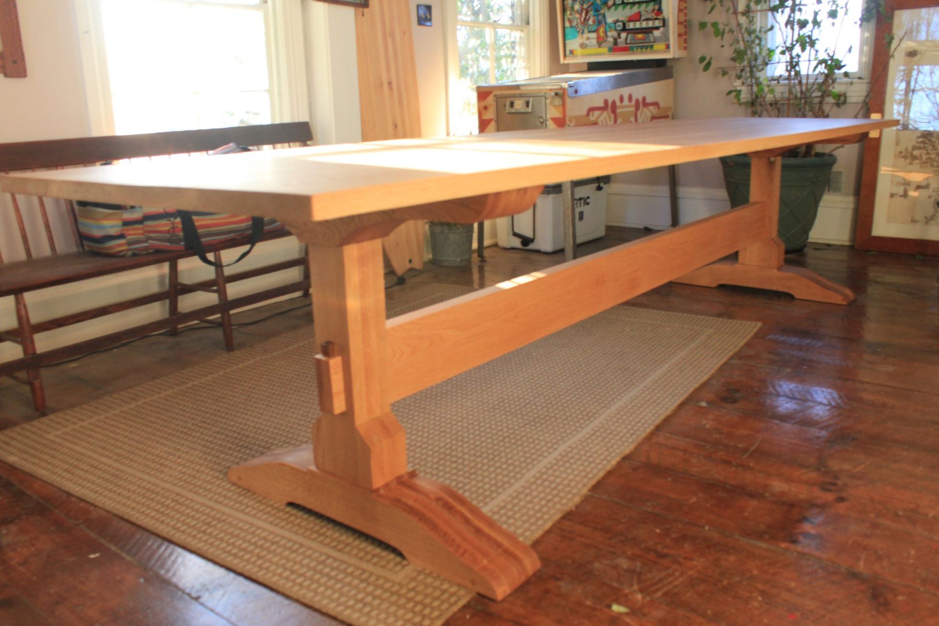 A wooden structure is sitting on top of a wooden table in a room