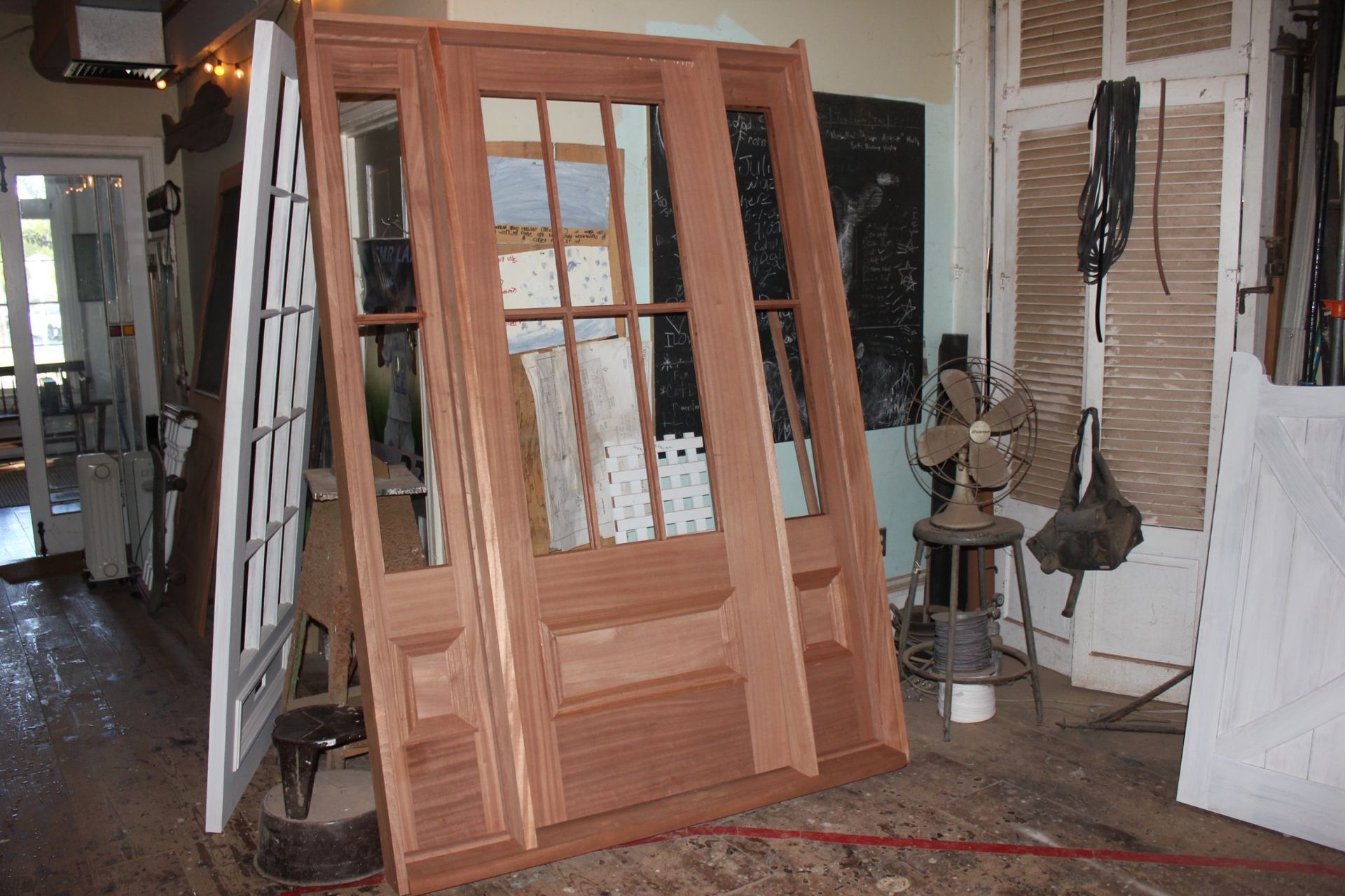 a wooden reproduction door is being built in a workshop