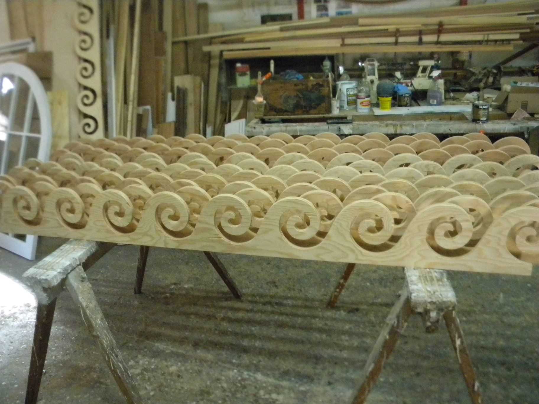 a large piece of custom wood with swirls carved into it