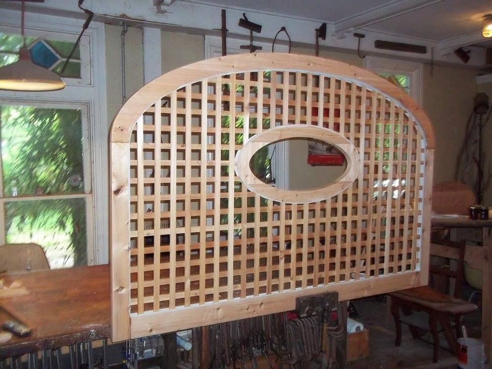 a custom built wooden fence with an oval hole in the middle