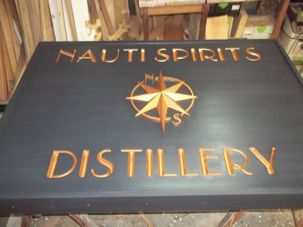 a custom made sign that says nauti spirits distillery on it