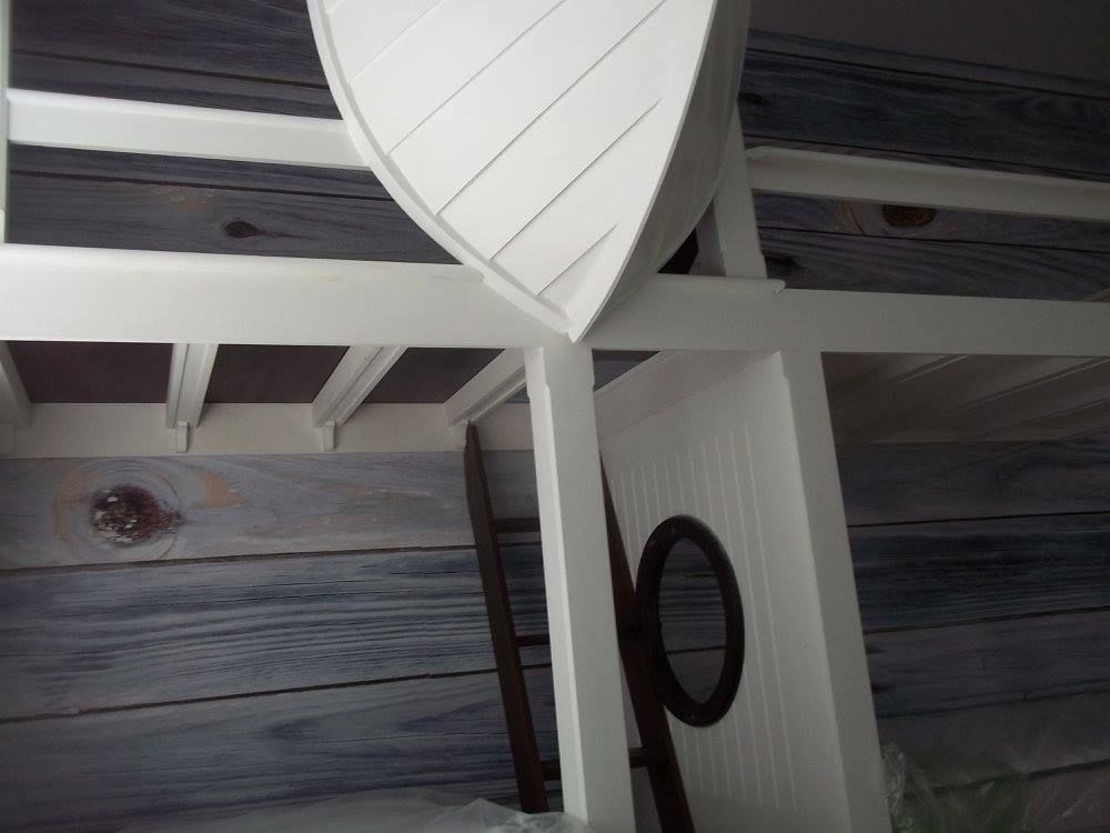 a custom built bunk bed with white paint on it