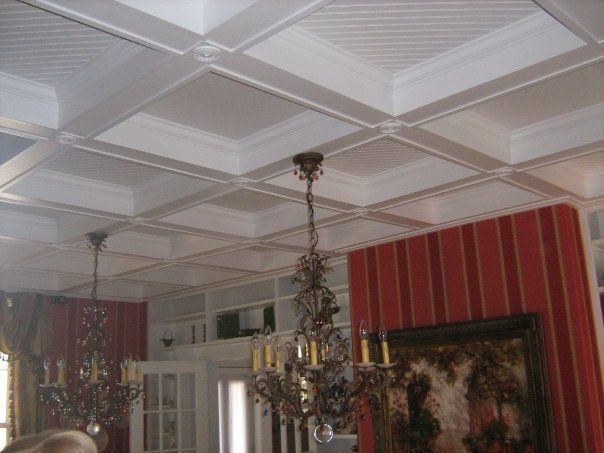 a room with a chandelier hanging from the ceiling