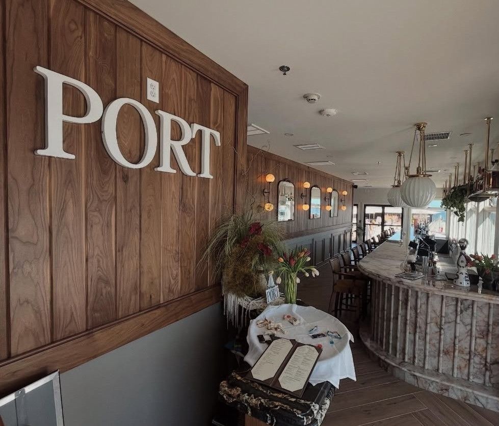 A restaurant with a sign that says port on it