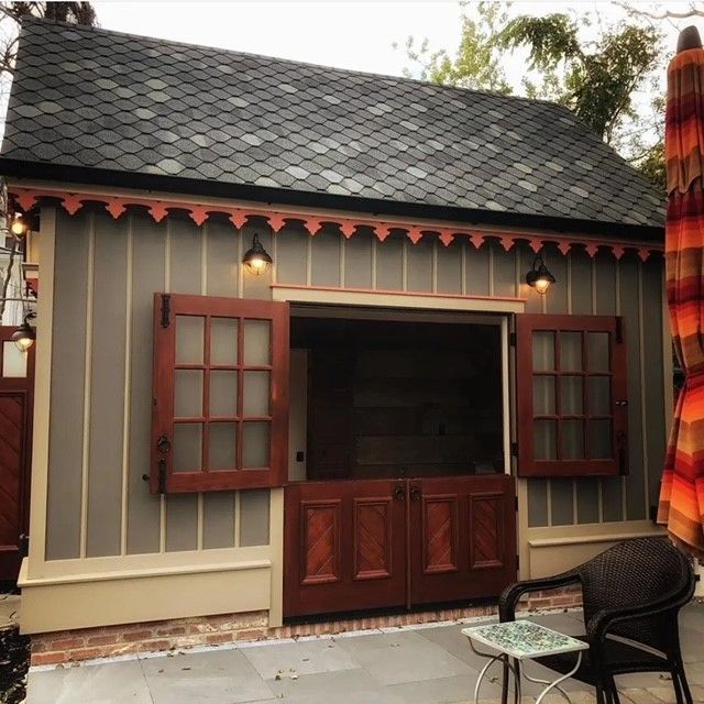 a small house with a roof that has wooden shingles on it