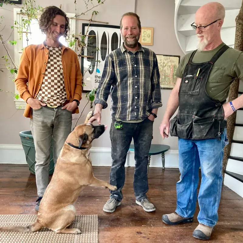 john hassay standing with brian lee and kip waide and dog gracie
