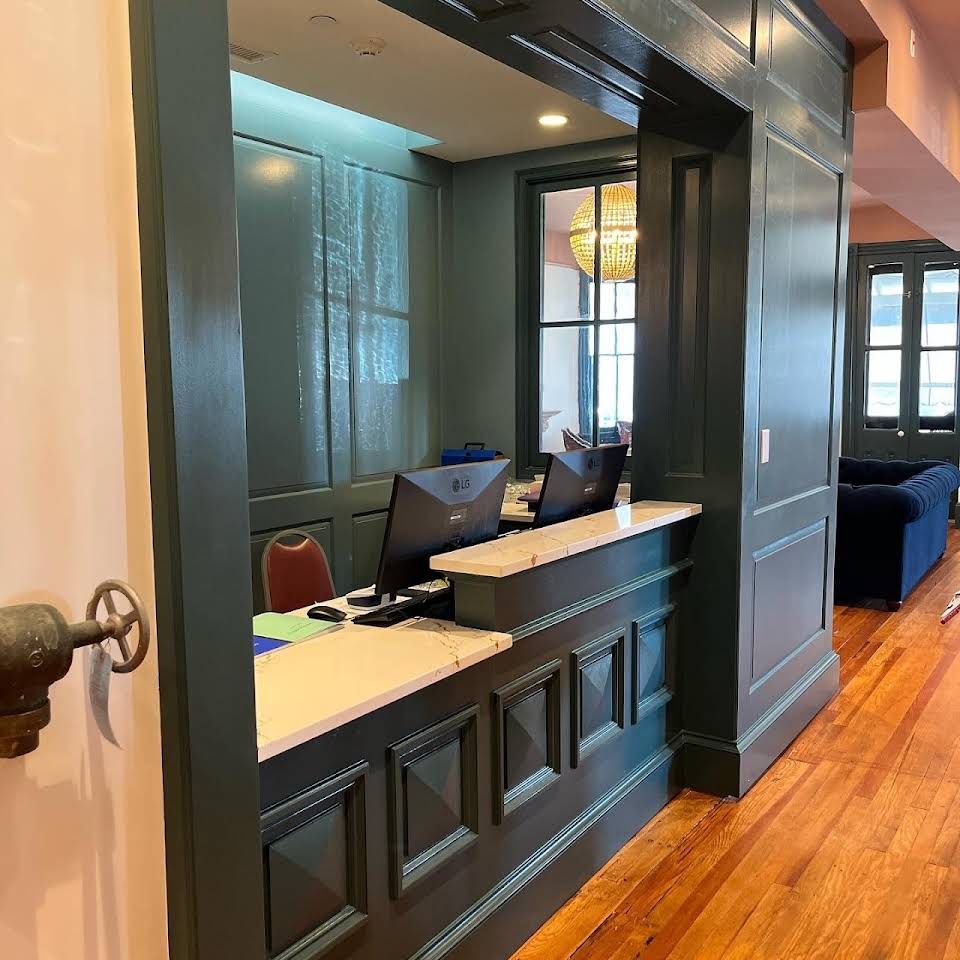 a custom reception desk with built-ins with computer on it