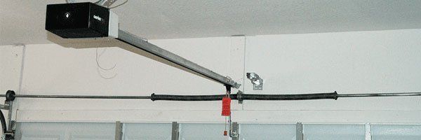 Garage door opener mechanism installed on the ceiling.
