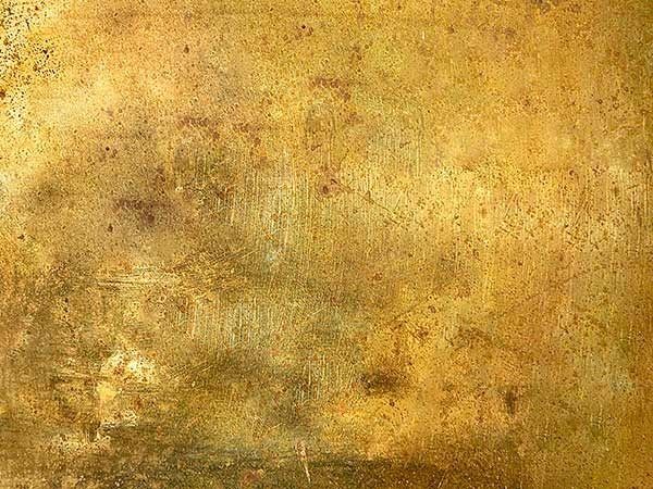 Superficie astratta color oro-marrone con texture e motivi screziati e dall'aspetto invecchiato.
