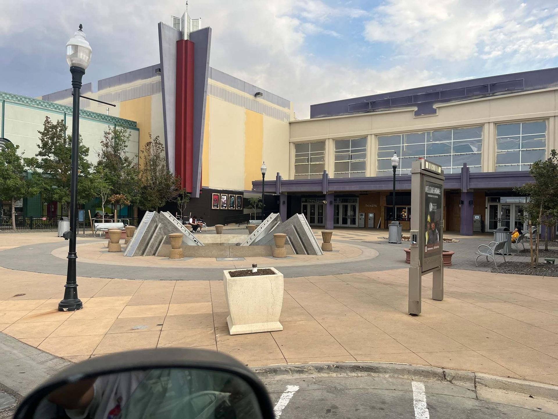 A large building with a fountain in front of it
