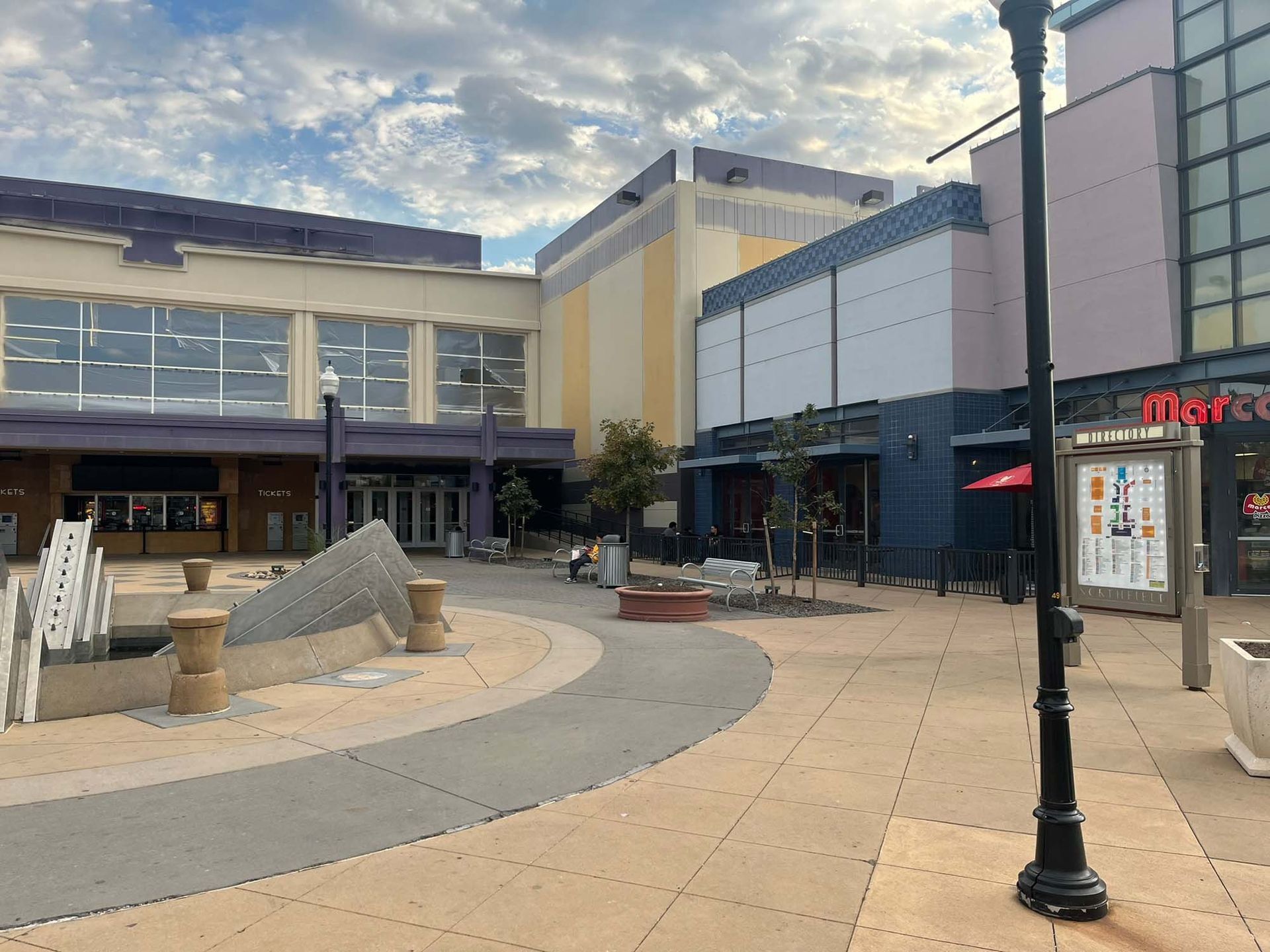 A large building with a fountain in front of it.