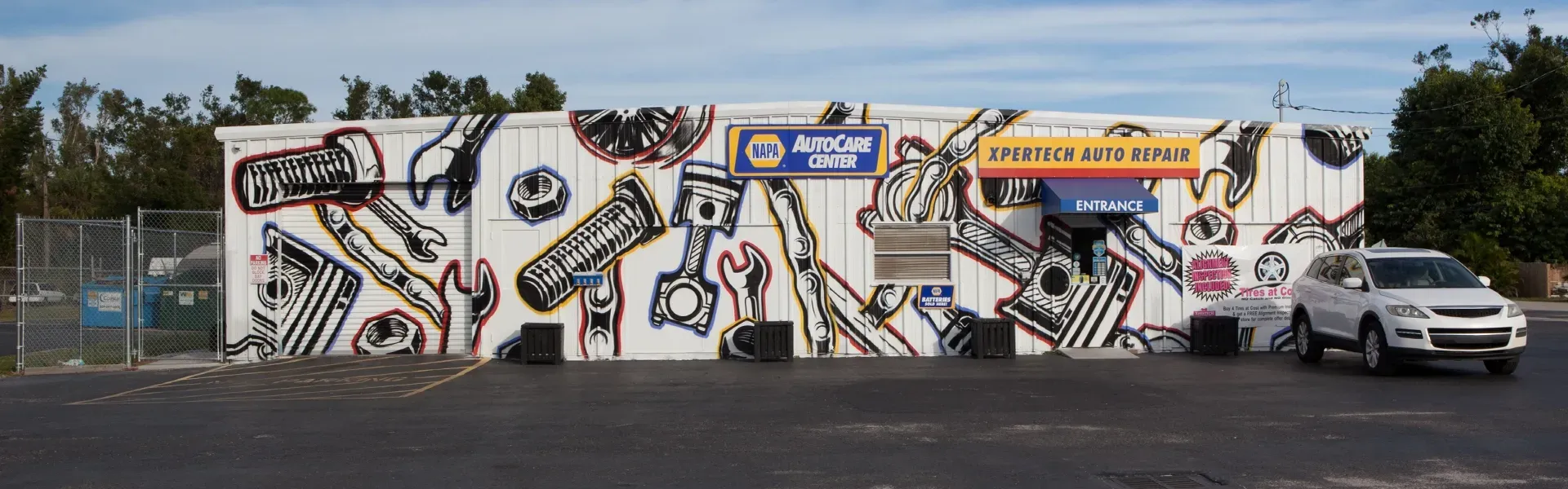 Three women from our team in front of shop | Xpertech Auto Repair, Inc.