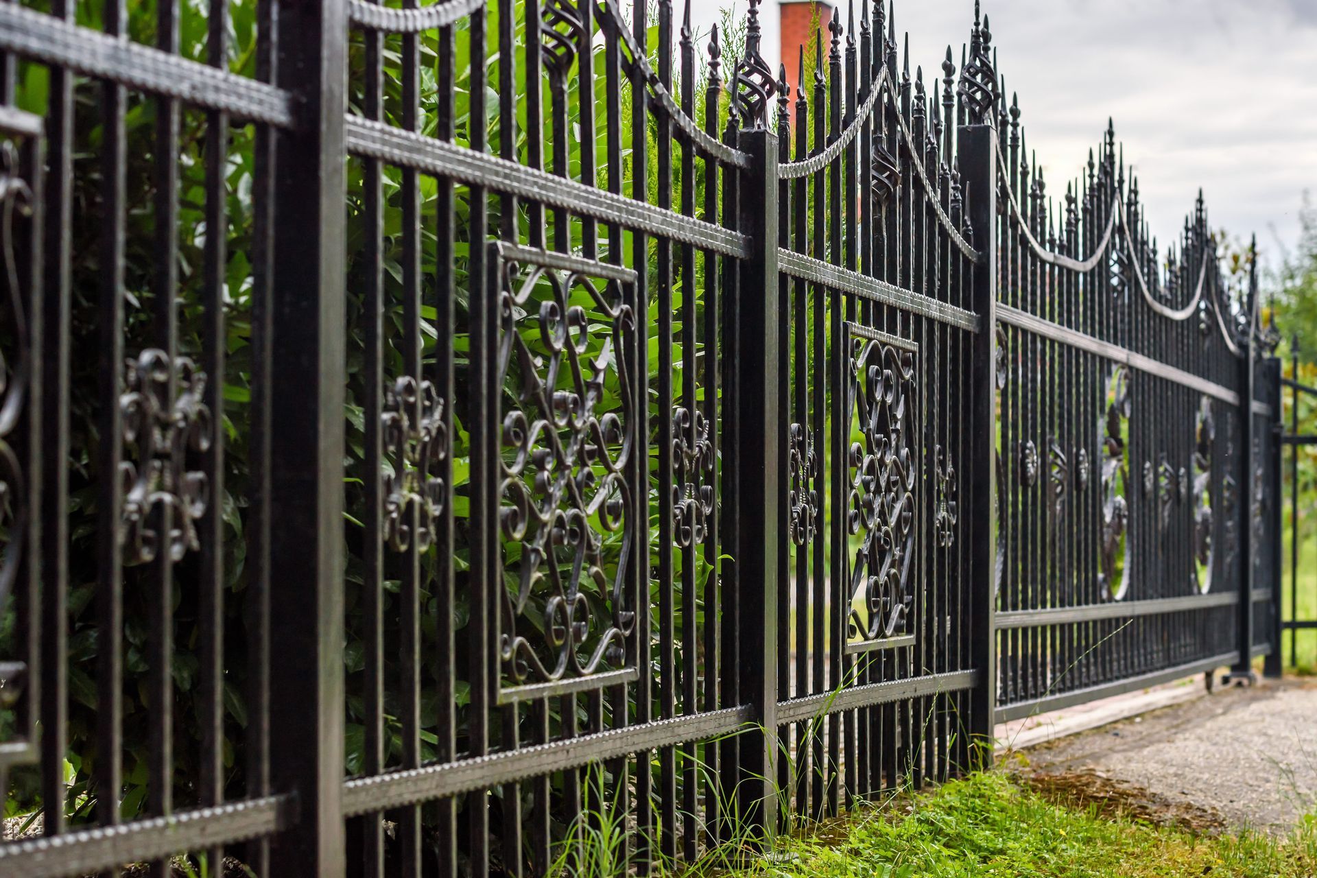 Wrought iron metal fence.
