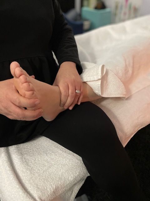 A Person Is Giving A Foot Massage To Another Person — Life24 Health Bowen Therapy In Lavington, NSW