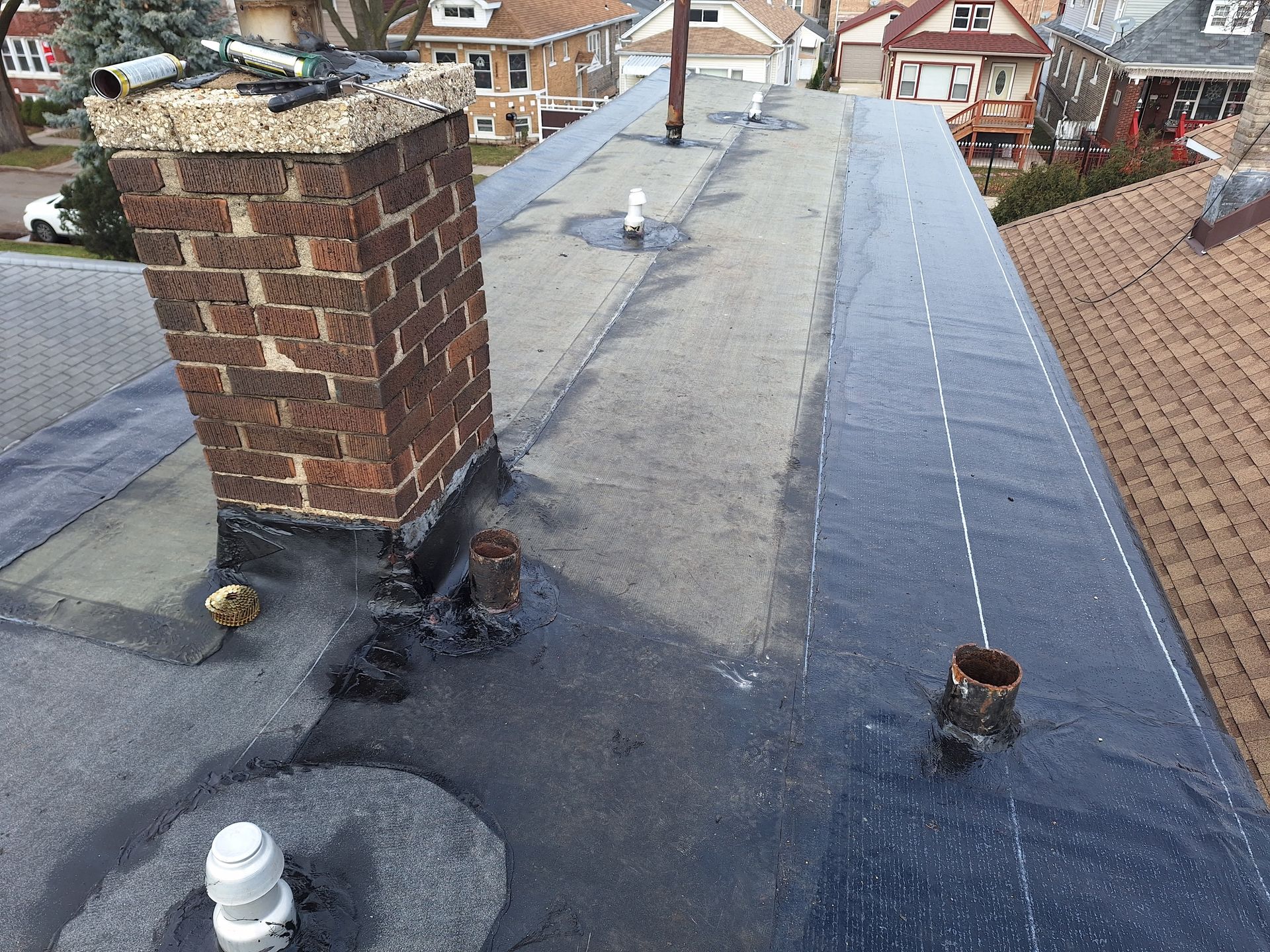 An aerial view of a roof with a chimney on it