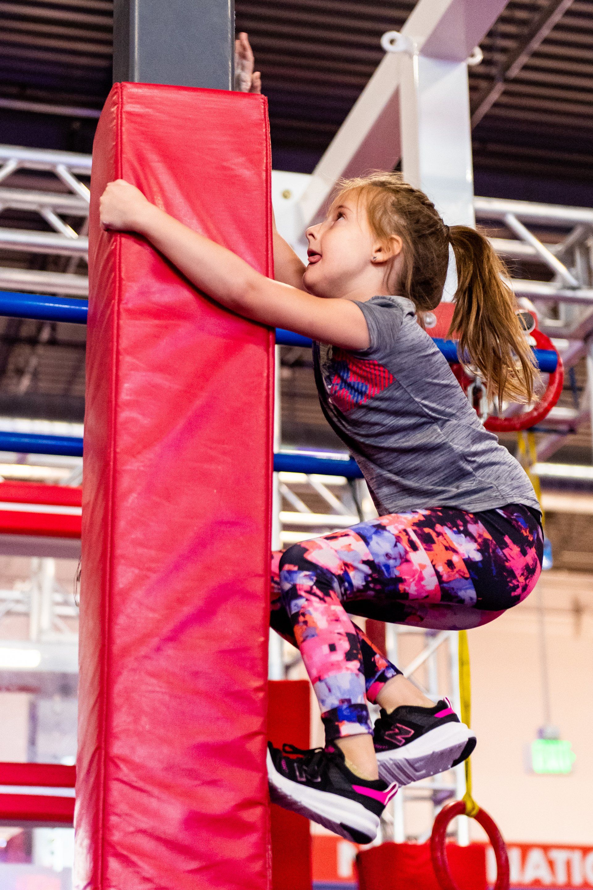 Child climbing ninja obstacle