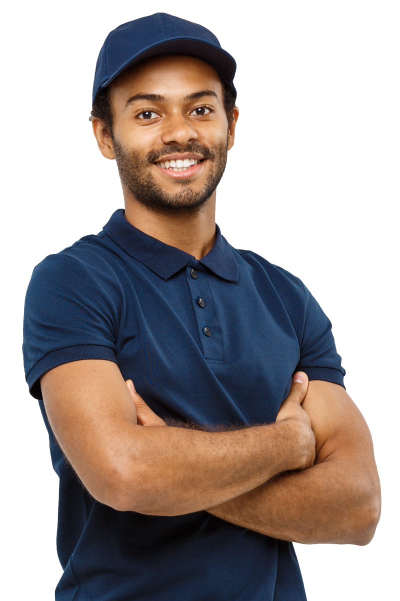 Man in blue polo shirt and cap smiles, arms crossed.