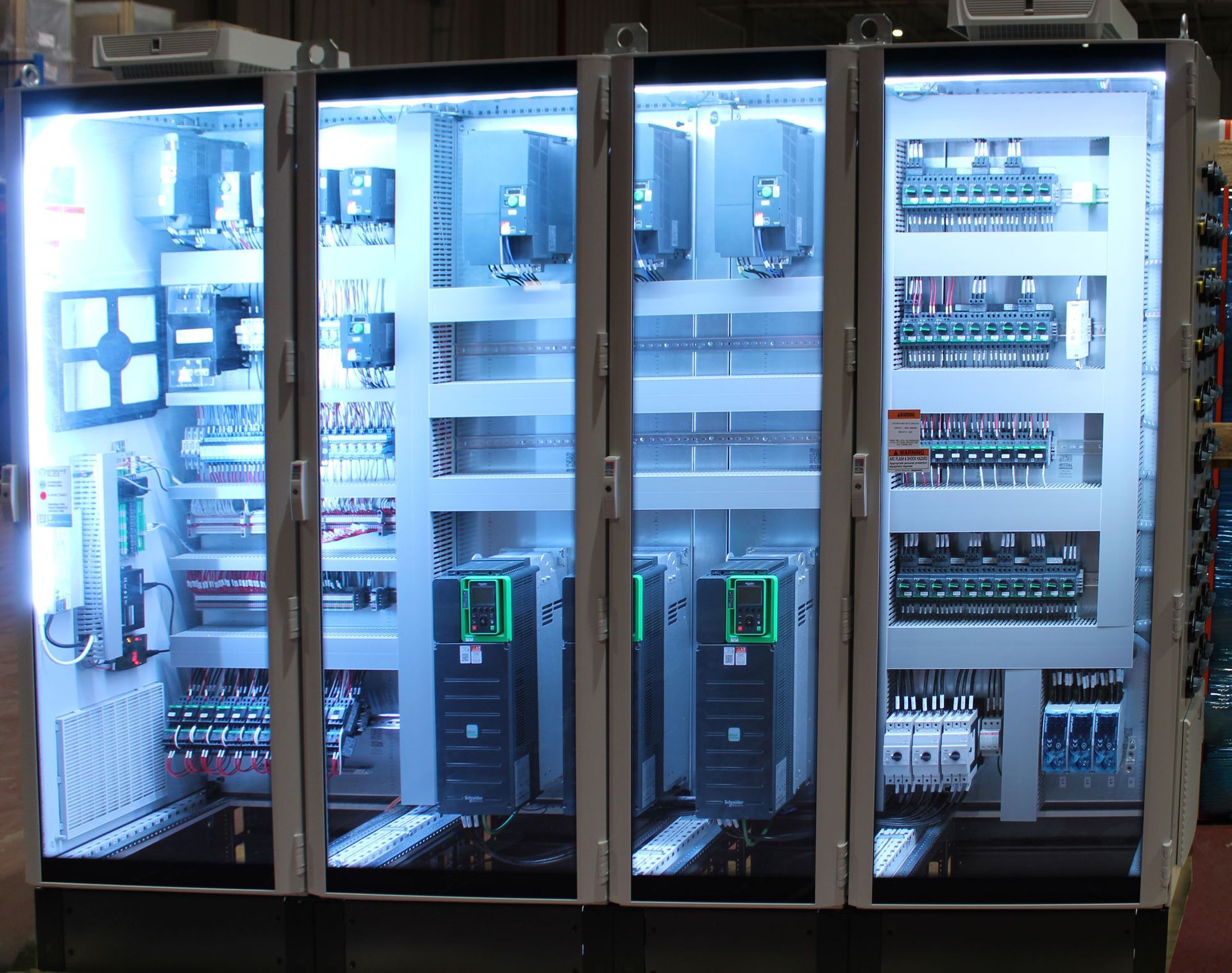 electrical cabinets with a blue light behind them