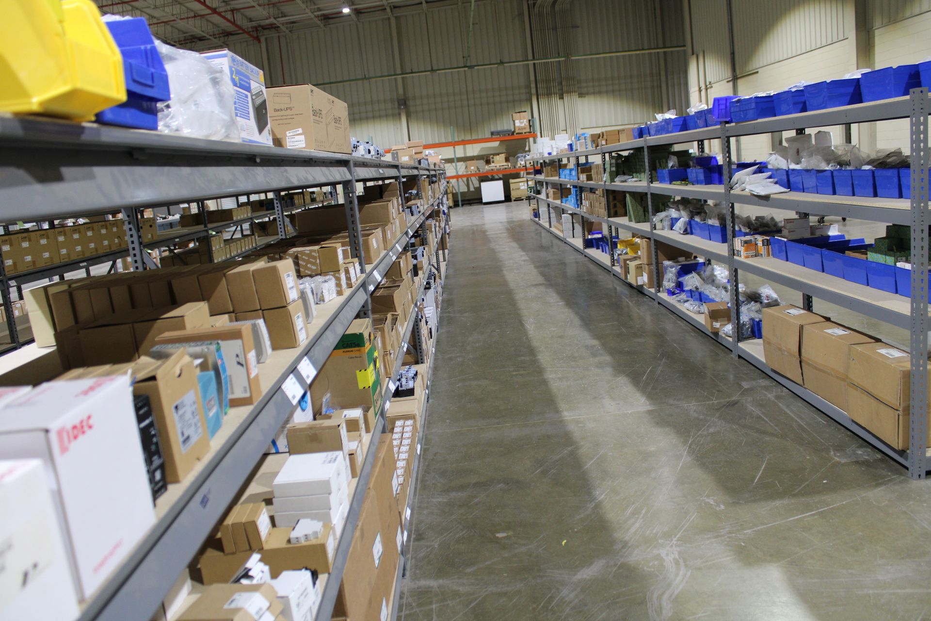 a warehouse filled with lots of boxes and shelves