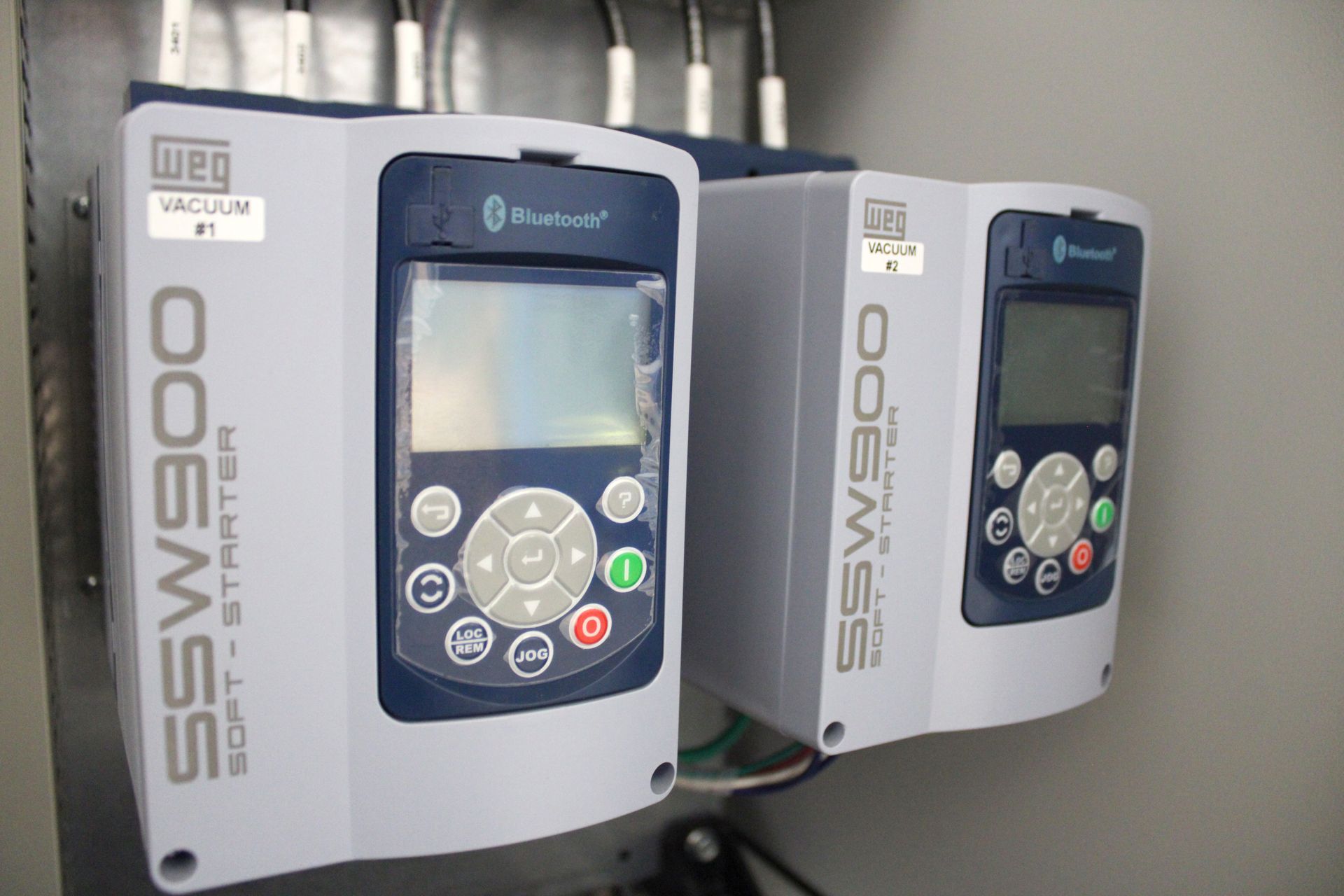 two key pads mounted in a cabinet that read soft-starter