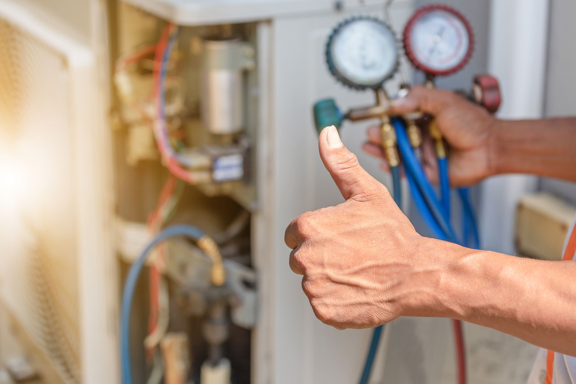 Air conditioner repair close-up, representing HVAC installation contractor. 