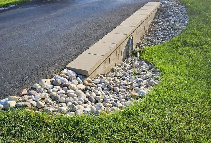 A stone wall along the side of a road